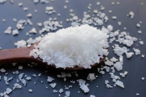 What are the dangers of sodium hydroxide or soda ash?